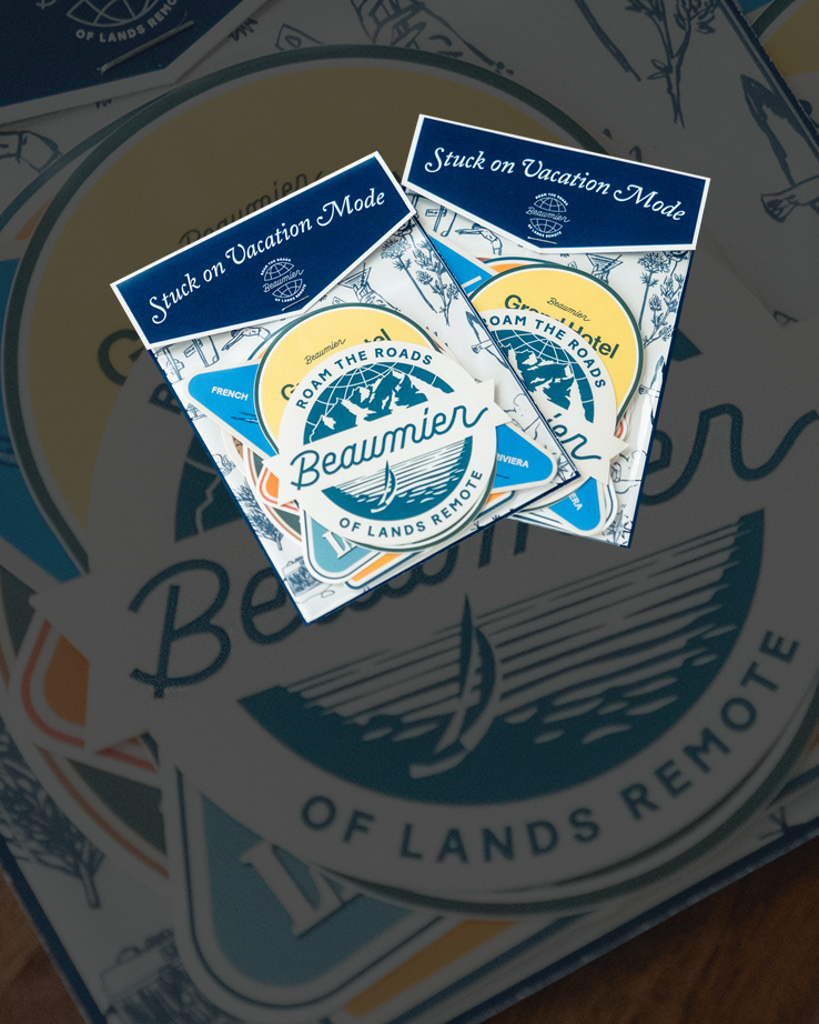 Two packs of circular stickers with "Beaumier" and "Stuck on Vacation Mode" designs, featuring nautical and travel-themed graphics.